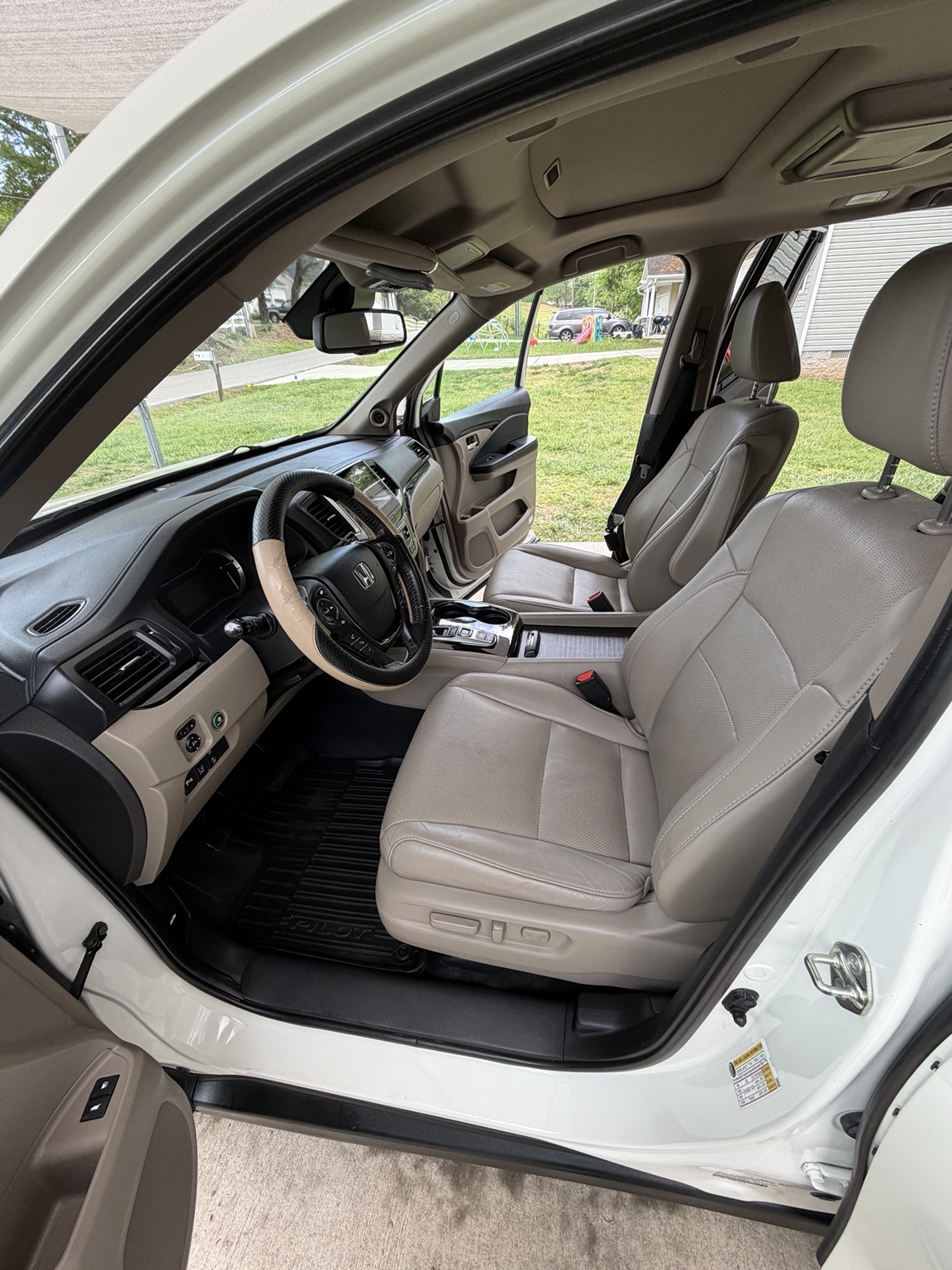 Detailed light colored vehicle interior